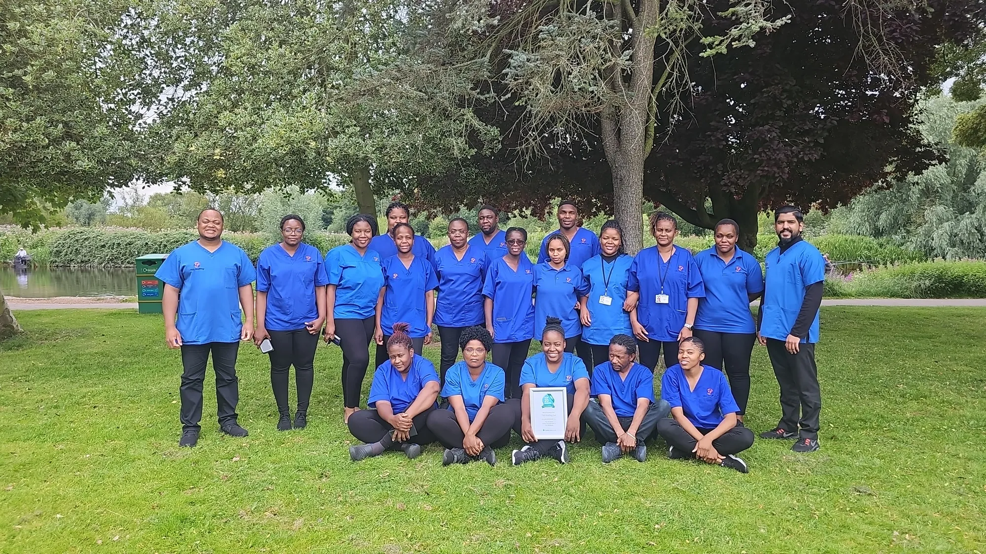 The TKS Staffing home care team of carers and coordinators in branded navy uniforms in Derby